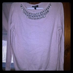 Light pink sweater with jeweled neckline